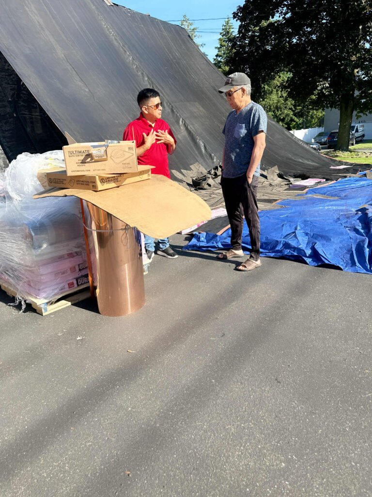 Ice dam formation on a roof in Waterbury during winter