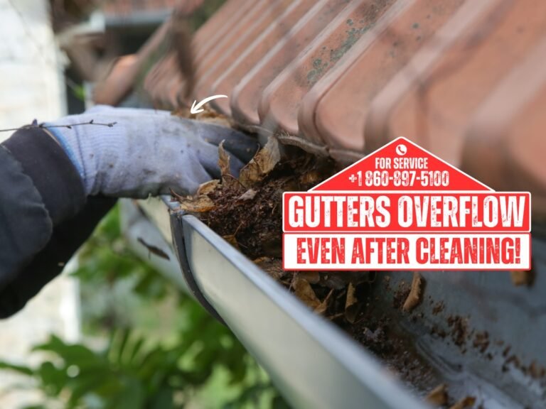 Gutters overflowing after cleaning on Waterbury CT home during rain
